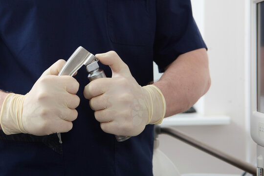 Laryngoscope for tracheal intubation in hands of an anesthesiologist. General anesthesia before surgery. Concept of healthcare. Saving a life.