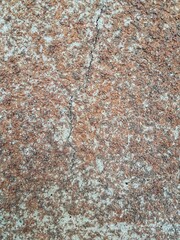 Fototapeta premium Cracked stone texture background with rough weathered surface