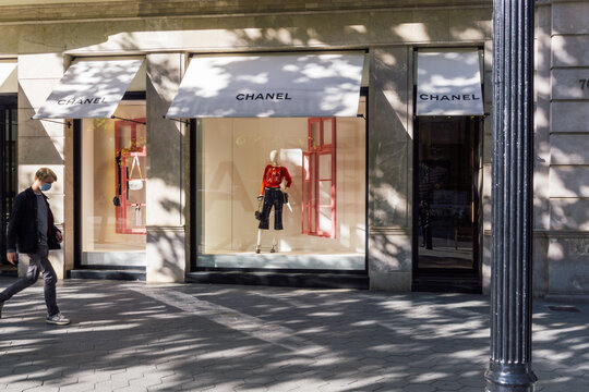Barcelona, Spain - May 11, 2021. Logo and facade of Chanel, it is a French fashion house, founded in Paris by the designer Coco Chanel, in 1910