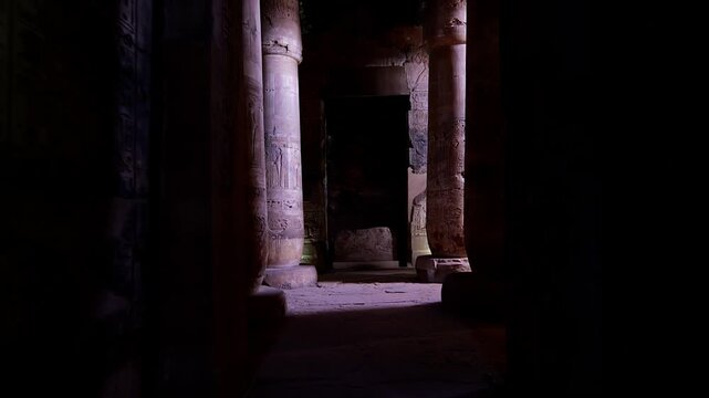 Ancient hall of the Abydos Temple with towering columns and intricate hieroglyphs, showcasing the spiritual depth and architectural mastery of Ancient Egypt.