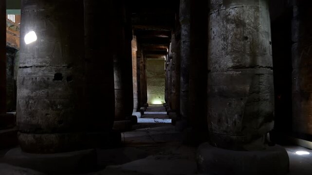 Ancient hall of the Abydos Temple with towering columns and intricate hieroglyphs, showcasing the spiritual depth and architectural mastery of Ancient Egypt.