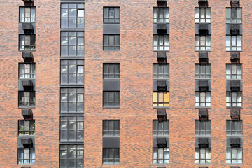 Fototapeta premium brick wall of a modern skyscraper, glass, steel. Brooklyn-style. wallpaper.