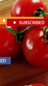 Vertical video: Tomatoes on board, camera steadying while social badges sliding over food for ad