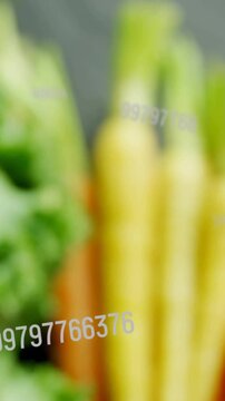 Vertical video: Cam panning revealing greens carrots tomatoes numeric overlay tracking for food ads