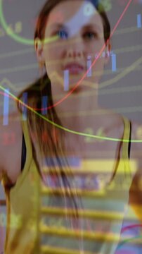 Vertical video: On workout start woman doing high-knees camera rising data overlay tracking fitness