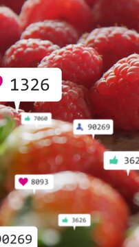 Vertical video: Camera shifting revealing berries with floating likes popping showing interest