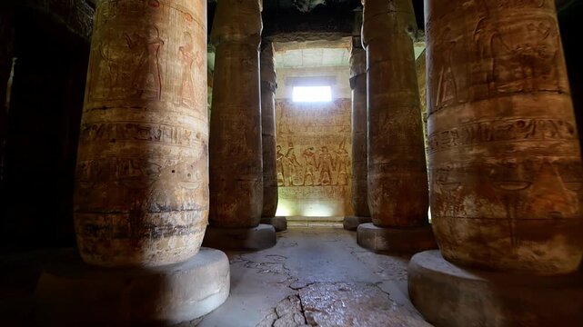 Ancient hall of the Abydos Temple with towering columns and intricate hieroglyphs, showcasing the spiritual depth and architectural mastery of Ancient Egypt.