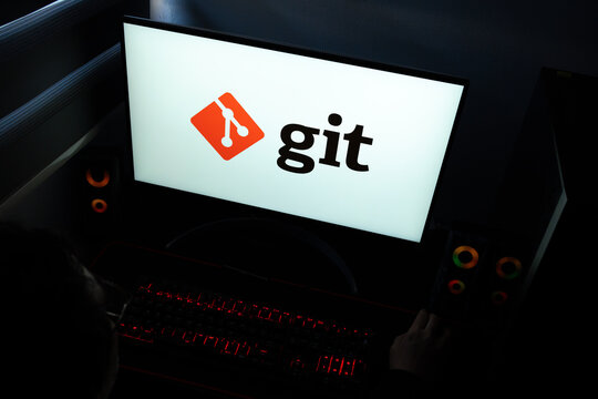 Punta Arenas, Chile &ndash; March 29, 2026: A desktop computer monitor in a dark room displaying the Git logo, representing the industry-standard distributed version control system for software development