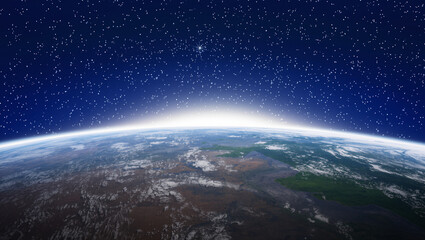 Obraz premium A stunning view of the earth from space with a starry night sky and a bright horizon