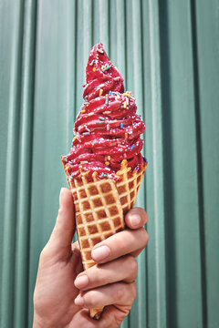 hand holding ice cream self serve yogurt waffle cone