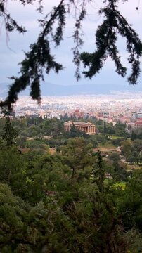 View of the Temple of Hephaestus at the city of Vertical footage, cloudy sky at the background
