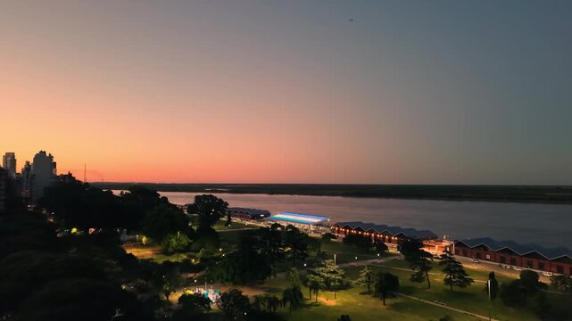 View of the modern public installation known as 'Aura' at the Costa Nueva waterfront area in Rosario, Argentina, during sunset