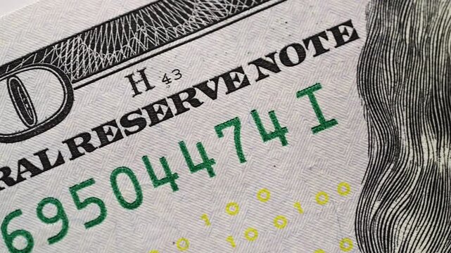 Macro slide camera shot US dollar banknote security details. Visible paper texture blue holographic ribbon liberty bell. Financial market banking treasury reserve economy savings success concept scene