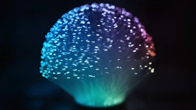Glowing blue fiber optic bundle with sparkling light strands