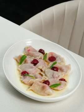 Azerbaijani dumplings - dushbara, on plate isolated