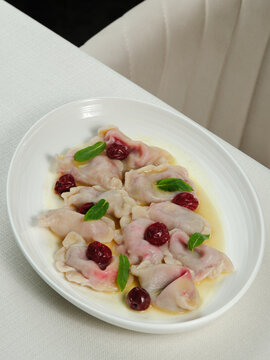 Azerbaijani dumplings - dushbara, on plate isolated