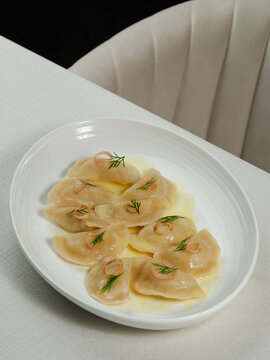 Azerbaijani dumplings - dushbara, on plate isolated
