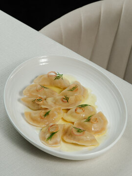 Azerbaijani dumplings - dushbara, on plate isolated