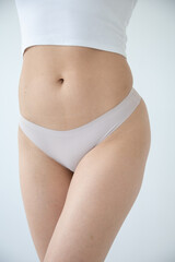 Fototapeta premium Close-up of beige underwear on a woman