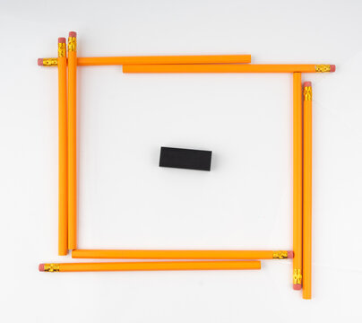 Pencils with a rubber isolated. Unsharpened yellow wooden graphite pencils