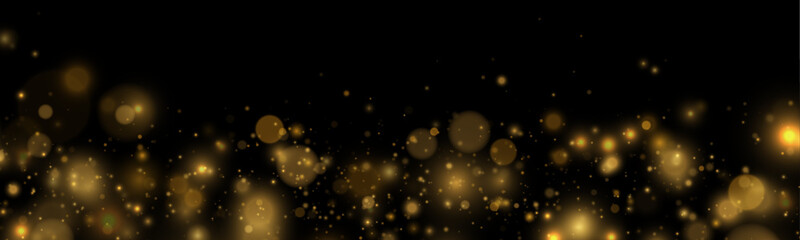 Bright golden sparks scatter across the dark background. Subtle reflections create a dreamy glow. The image conveys magic and wonder. © goldstock