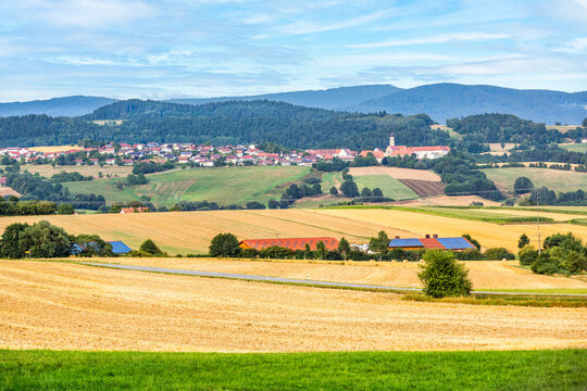 Rolling hills landscape with the town of Windberg, in Bavaria, Germany as viewed from the A3 highway