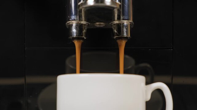 Coffee brewing process with machine in a kitchen during morning hours