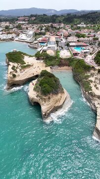 Walking along the scenic coastal path of Sidari, Corfu, featuring the iconic Canal d'Amour rock formations. Beautiful Greek island landscape with crystal clear blue water and white sandy beaches.
