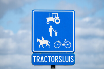 Tractor barrier on rural road in Zellik Belgium © Werner