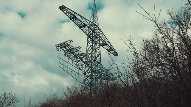 High voltage power lines against sky