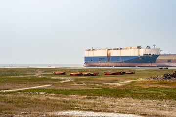 Fototapeta premium Beached cargo ship at Chittagong ship breaking yard.