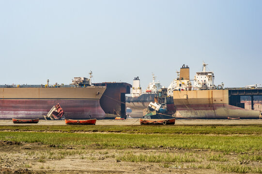 Massive cargo ships being dismantled at Chittagong ship breaking yard.