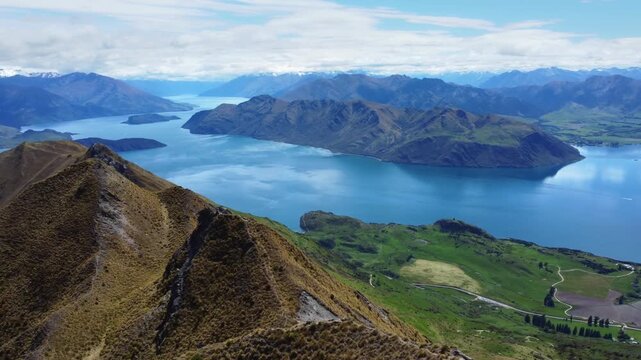 A beautiful drone footage of Roys Peak mountain in New Zealand, stunning Landscape of Wanaka lake in New Zealand South island near Wanaka