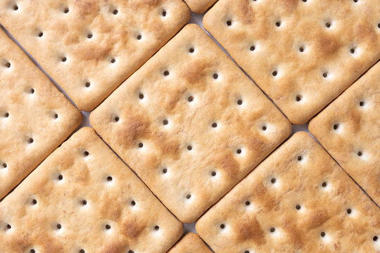Сlose-up of diagonal pattern of grain cookies. Healthy eating background