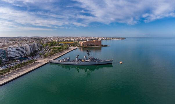 Panoramic aerial view of the historic naval museum Velos destroyer anchored at the Nea Paralia promenade in Thessaloniki, Greece.