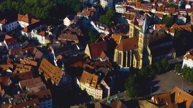 An panoramic aerial view around the old town in the city Esslingen on a sunny summer afternoon in Germany .