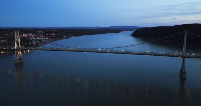 Poughkeepsie, NY, Early spring night arial video of the Franklin D. Roosevelt Mid-Hudson Bridge looking toward Poughkeepsie. 