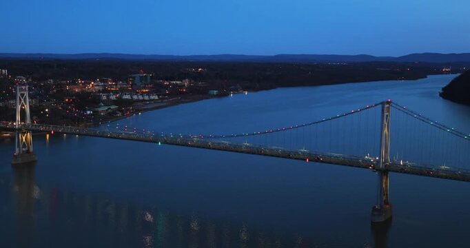 Poughkeepsie, NY, Early spring night arial video of the Franklin D. Roosevelt Mid-Hudson Bridge looking toward Poughkeepsie. 