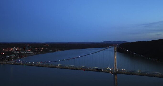 Poughkeepsie, NY, Early spring night arial video of the Franklin D. Roosevelt Mid-Hudson Bridge looking toward Poughkeepsie. 