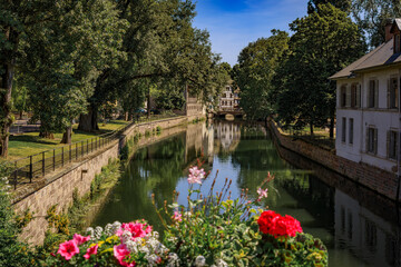 Fototapeta premium Half timbered houses with flowers, canals of Petite France in Strasbourg, France
