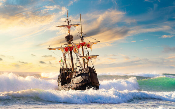 Grand view of an old sailing ship from the times of pirates on the high seas with big waves