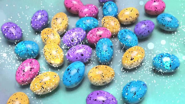 Pastel speckled easter egg candy on a light surface offers a vibrant and festive touch, suitable for easterthemed designs.