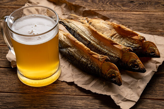Hot smoked fish Baikal omul Coregonus autumnalis on wooden table