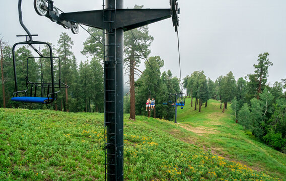 Ski lift in the clouds and fog on a summer day in the Santa Catalina Mountains near Tucson Arizona