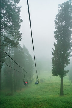 Ski lift in the clouds and fog on a summer day in the Santa Catalina Mountains near Tucson Arizona