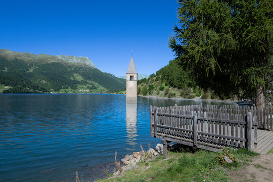 Reschen See - Reschen Lake - Lago di Resia - Tower of the sunken village of Graun. South Tirol, Alto Adige, Italy