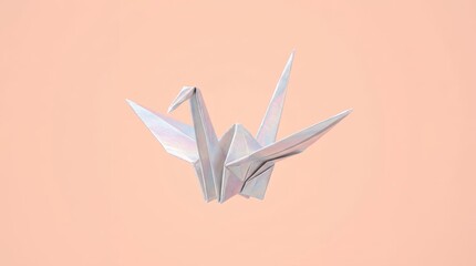 Obraz premium Elegant white origami paper crane bird on soft peach background with minimal style