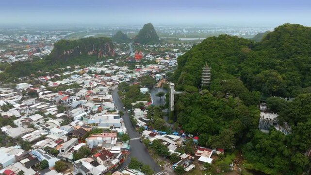 Aerial view of the Marble Mountains, a cluster of limestone hills in Da Nang, Vietnam. The mountains are a popular tourist destination for sightseers and climbers.