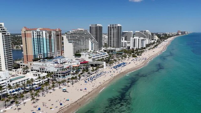 Spring breakers enjoying a sunny Ft Lauderdale Beach day near Las Olas Blvd in Broward County, Florida. 