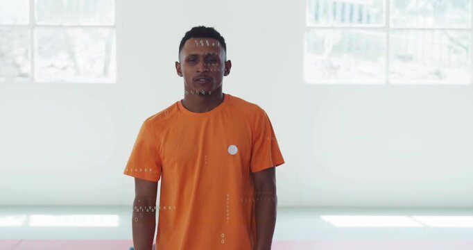 Walking man in bright orange shirt starting workout, approaching camera, folding arms, HUD overlays